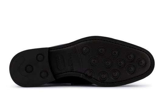 Schwarzer Mokassin aus bedrucktem Leder