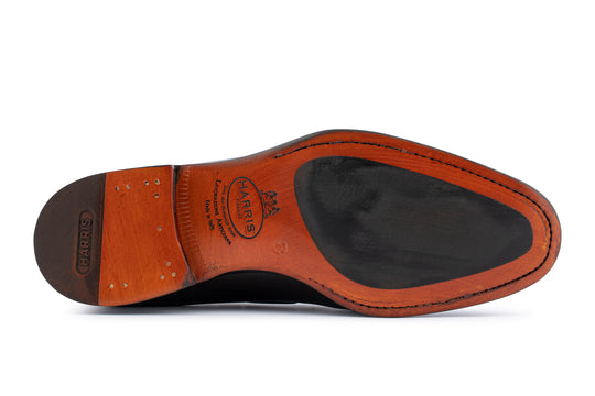 Mocassino in pelle con pon pon