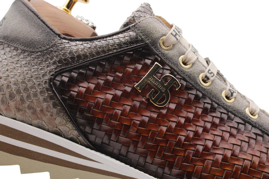 Sneakers in woven leather and python